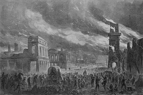 city on fire, many people in the streets