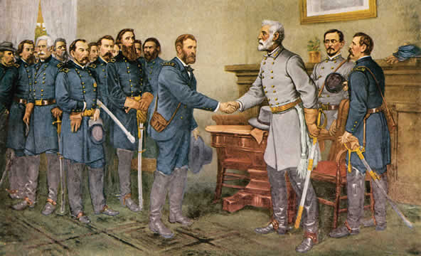 two men shake hands while others look on