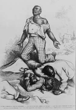 One man kneeling with other men lying on the ground