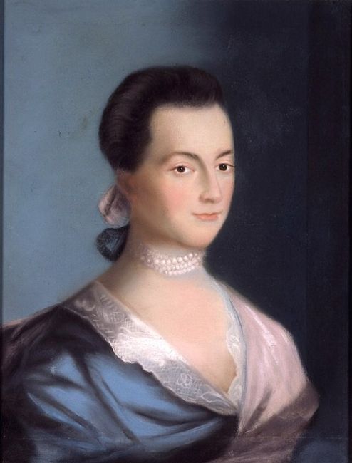 A painted portrait of Abigail Adams wearing a white bonnet and dress with lace trim, seated and facing slightly to the side.