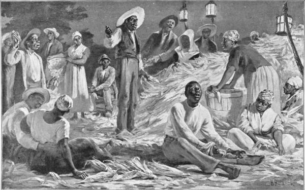 This black-and-white illustration depicts a scene of enslaved African Americans gathering at night, possibly after working in the fields, with some figures seated and others standing in a group illuminated by lanterns. The central figure standing on a raised area appears to be speaking to the group, suggesting a religious meeting, an informal gathering, or a shared moment of rest after forced labor.