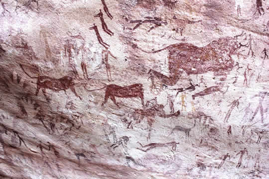 animals and other figures on a cave wall