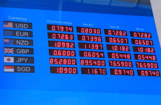digital board showing the exchange rate for different currencies
