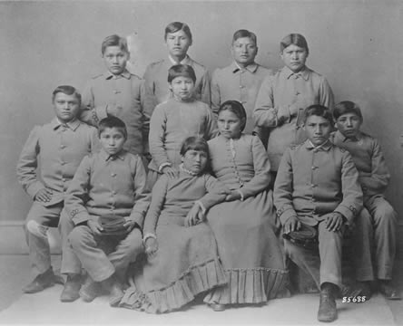 Photograph of young adults in uniform posing for the camera