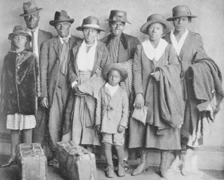 A family of three generations dressed for traveling