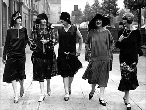 vintage photo of five women dressed in flapper dresses in the 1920s