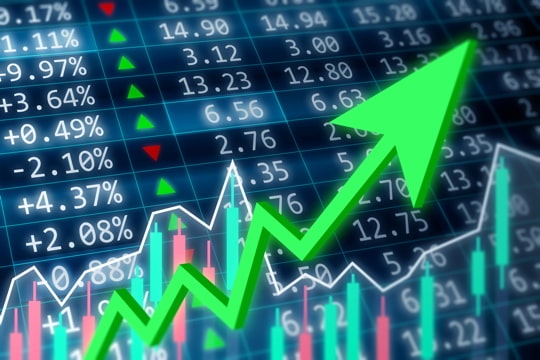 image of a stock exchange board with an upward arrow