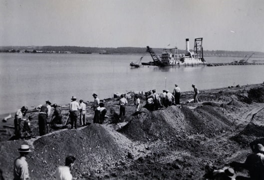 photograph of men digging along the Potomac River