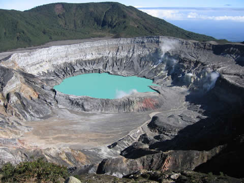 a pool of water surrounded by mountains