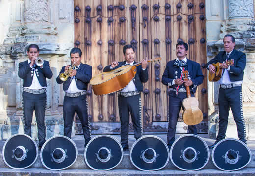 men playing instruments on a stage