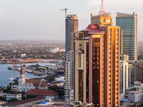 skyscrapers alongside shorter buildings and water
