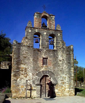 exterior of old stone building with bells