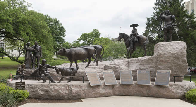 statues of people and cattle