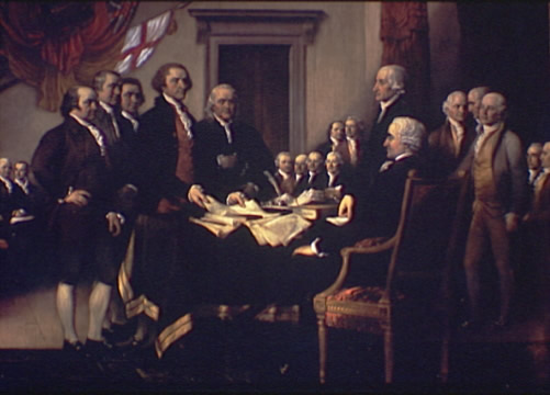a group of men signing the Declaration of Independence at the Second Continental Congress