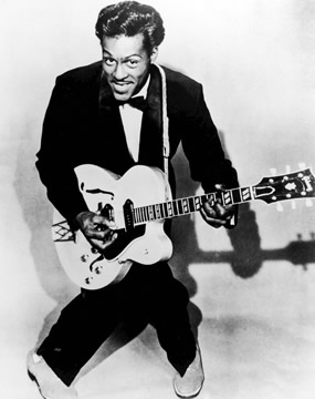 photograph of rock & roll singer Chuck Berry holding his electric guitar