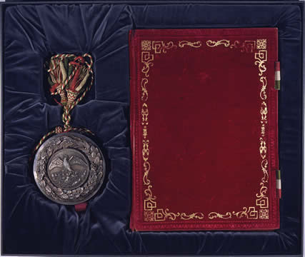 photo of book and medal