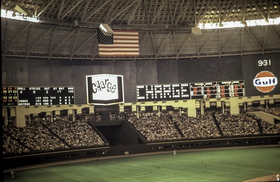 photo of the inside of the Astrodome showing the baseball field and the scoreboard
