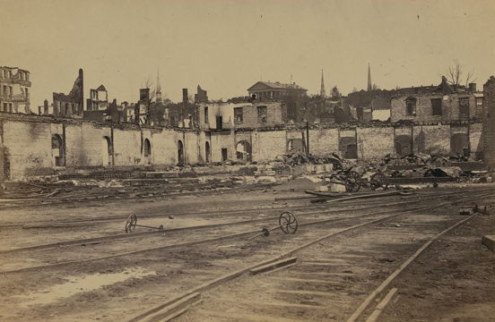 old photo of a train station that has been bombed
