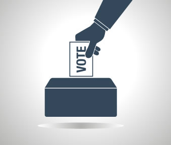 putting a vote into a ballot box