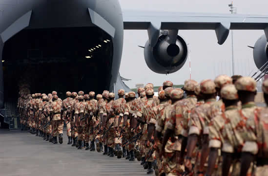 soldiers boarding a military plane