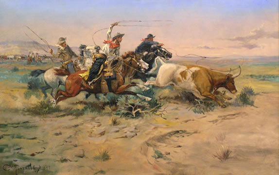 cowboys chasing cattle