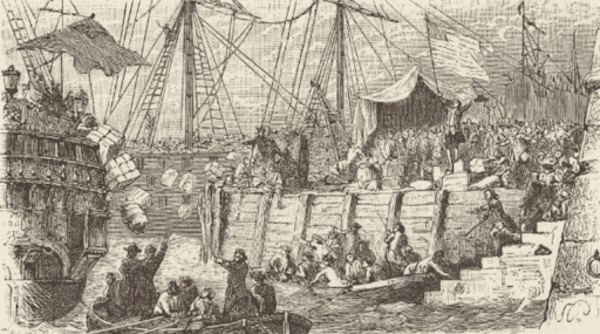 A black and white engraving shows a large crowd of people gathered on a bustling dock next to a sailing ship. The people are shown throwing large crates and barrels into the water, a depiction of the Boston Tea Party.