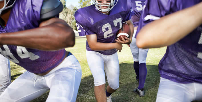 football team on the field during a game
