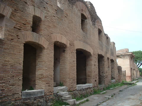 two-story stone building with archways