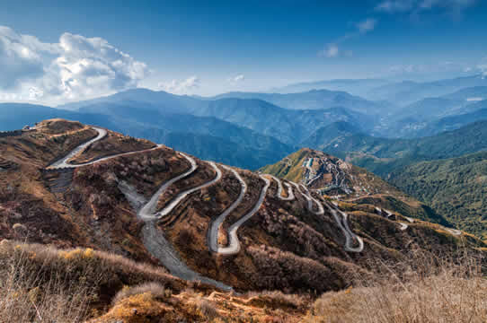 Photograph of a winding road on a barren mountainside