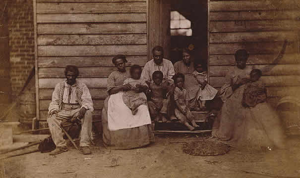 Photograph of slaves sitting outdoors