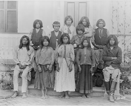 Barefoot teenagers posing for the camera
