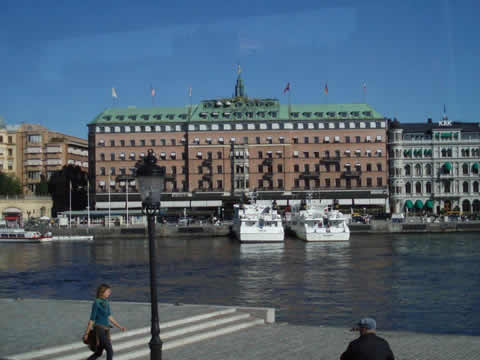 an imposing building over the other side of the river