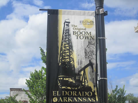 a poster hanging from a lamp post