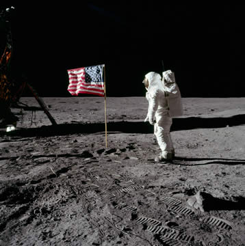 astronaut saluting American flag on the moon