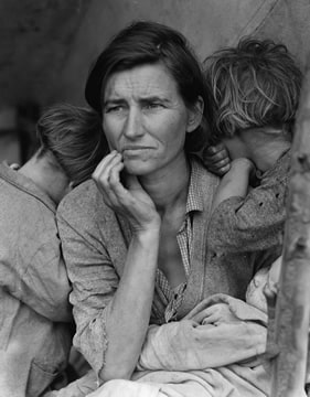 photograph of a worried mother and two children burying their heads against her shoulder, as if in despair
