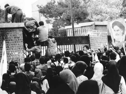 people climbing over a gate