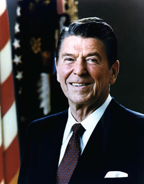 portrait of a man with a U.S. flag in the background