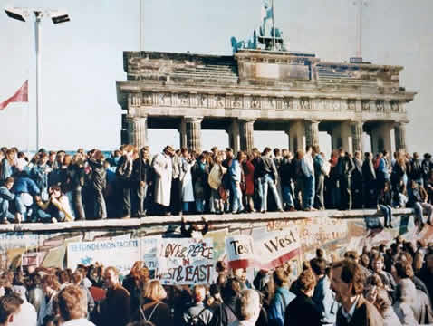 crowds by a large gate