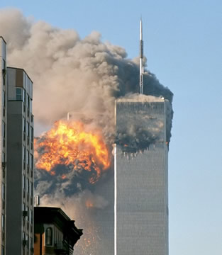 the top part of a tower on fire
