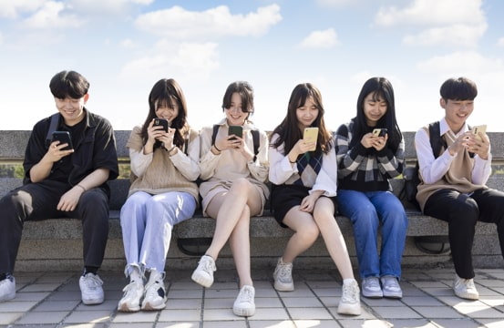 teenagers on their phones