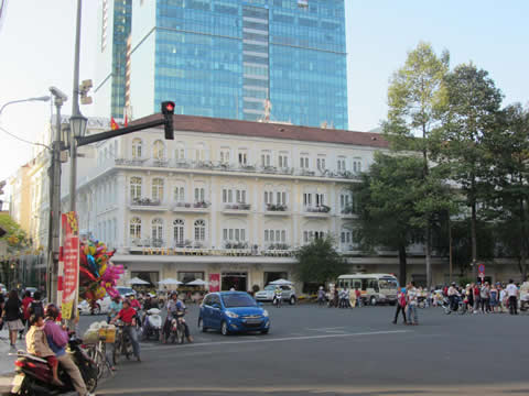 a high-rise building behind another building in a city