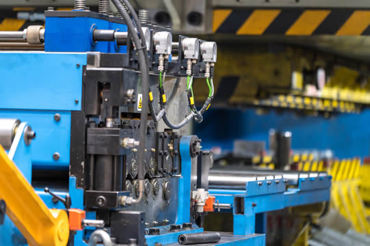 a close-up photo of a complex manufacturing machine