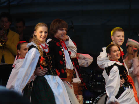 couples dancing wearing traditional costumes